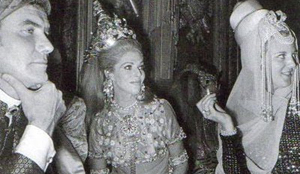 Then Crown Princess Margrethe of Denmark - holding her signature cigarette -  her husband Prince Henrik of Denmark with baroness Marie-Hélène de Rothschild at Baron de Rédé's Bal Oriental on December 5, 1969.